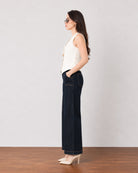 Ginger beige breathable lyocell linen vest, side profile showing the pointed hem and fitted waist