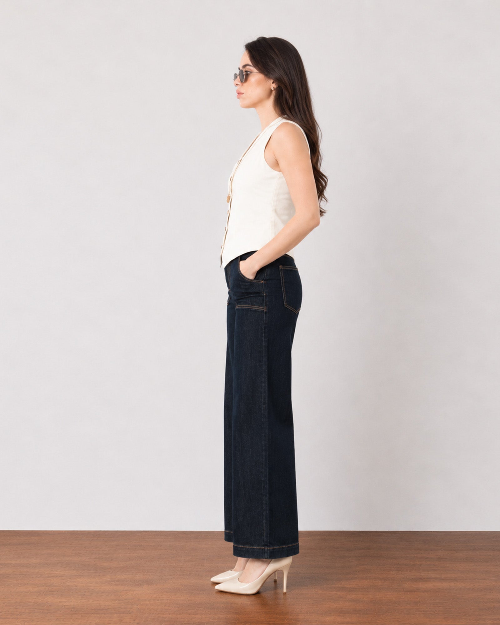 Ginger beige breathable lyocell linen vest, side profile showing the pointed hem and fitted waist