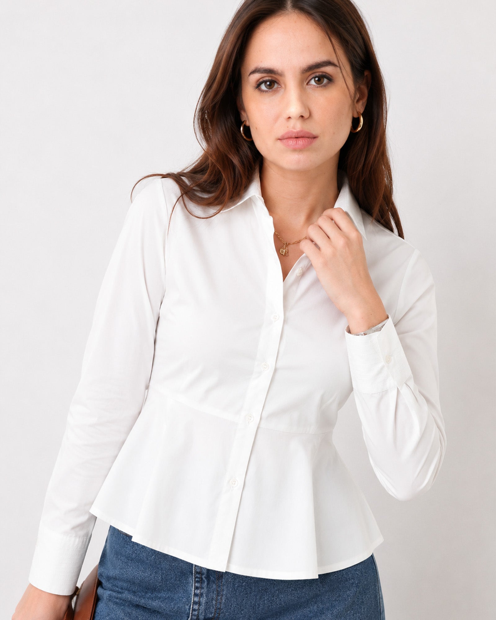 Close-up of Giselle white shirt classic collar, button placket and buttoned sleeve cuff