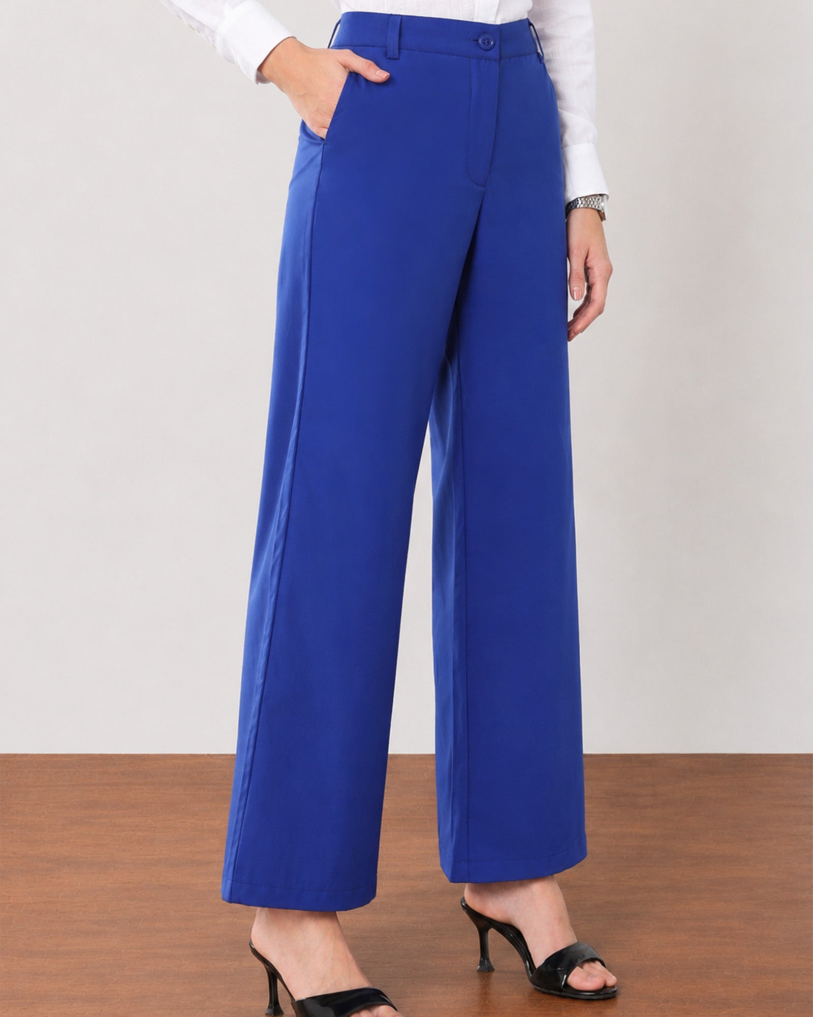 Glin royal blue cotton satin pants with deep side pockets, close-up of the voluminous wide leg drape