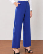 Glin royal blue cotton satin pants with deep side pockets, close-up of the voluminous wide leg drape