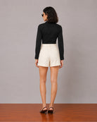 Goldy beige double pleated linen shorts with full cambric lining, back view
