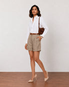 Goldy muddy brown high waisted linen shorts, walking view