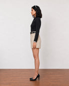 Grace beige linen pleated shorts with full cambric lining, side profile view