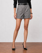 Grace charcoal grey linen shorts with a neat cuffed hem, cropped waist-down front view