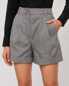 Close-up of Grace charcoal grey linen shorts high waistband, button fly and double front pleats