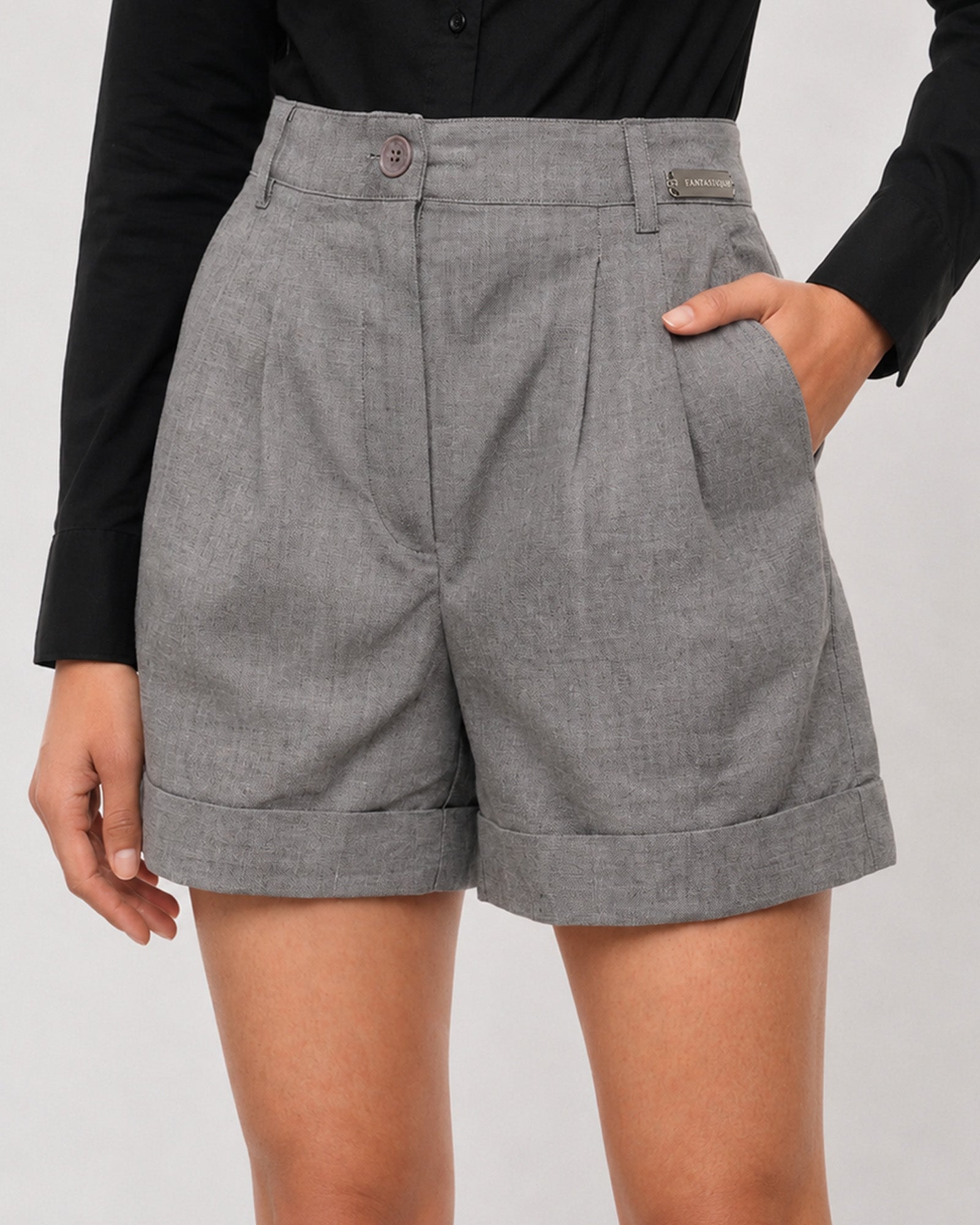 Close-up of Grace charcoal grey linen shorts high waistband, button fly and double front pleats