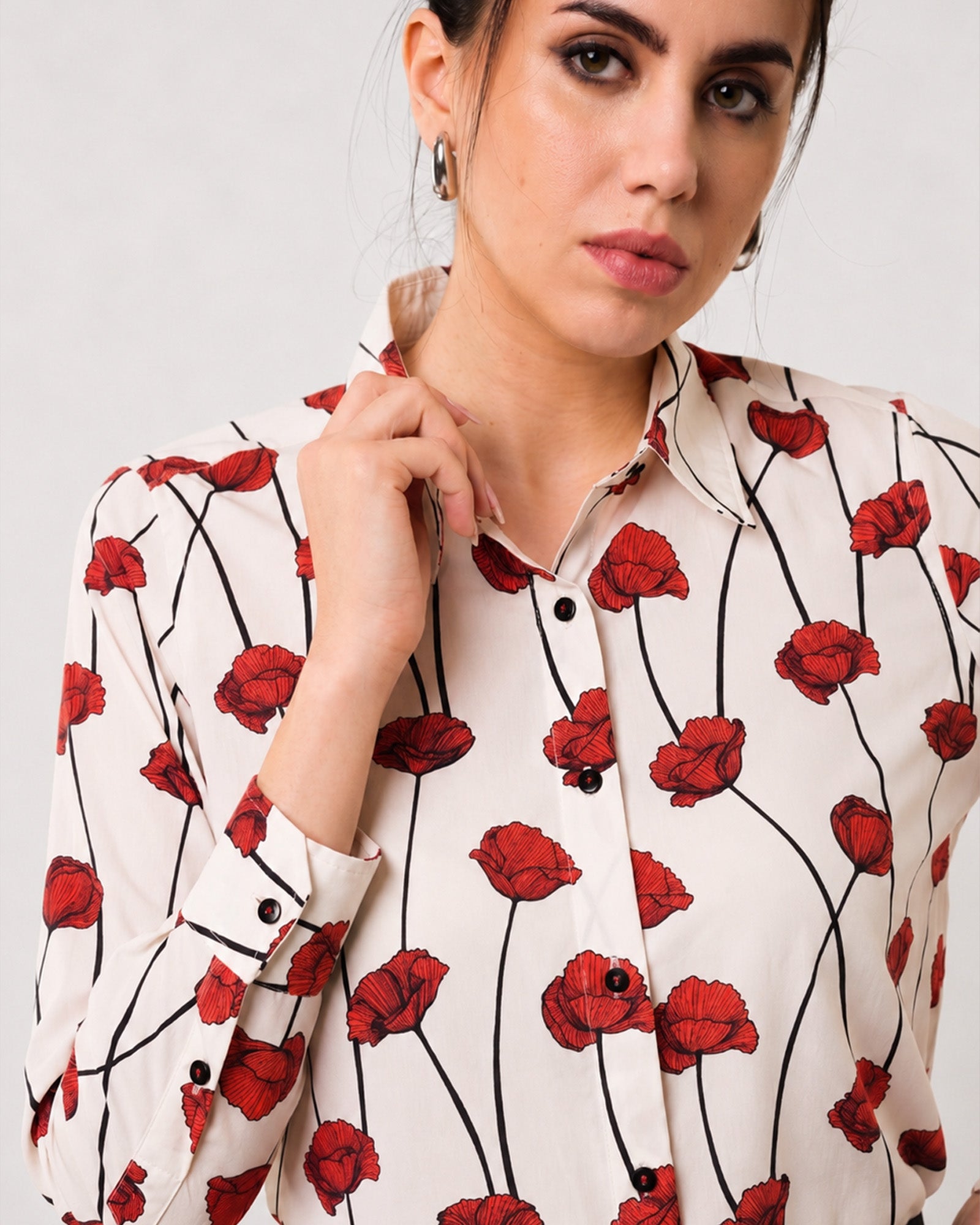 Greth red floral print cotton shirt with a classic pointed collar and full button-down placket, close-up view