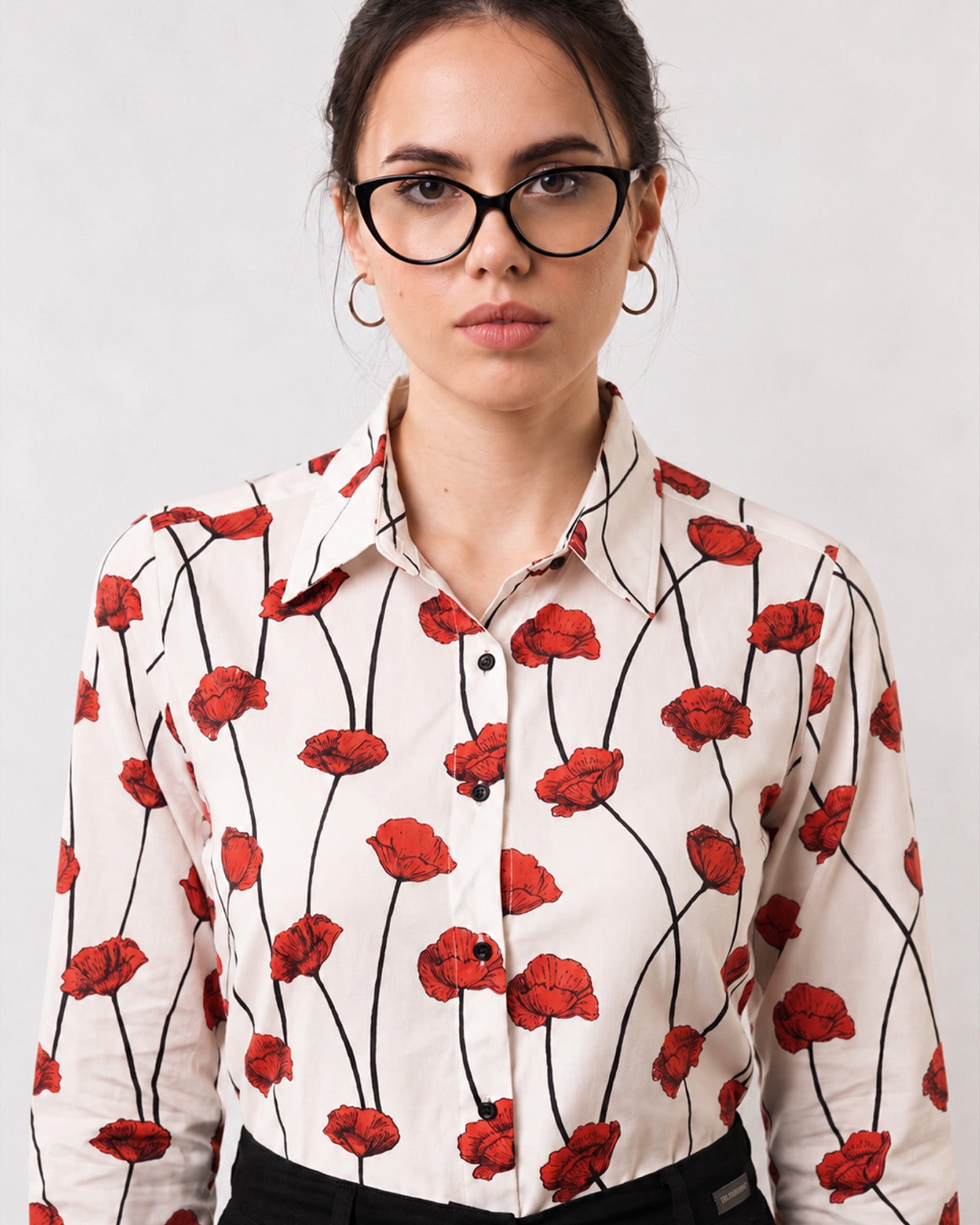 Close-up of Greth shirt red poppy digital print with contrast black buttons and buttoned cuff