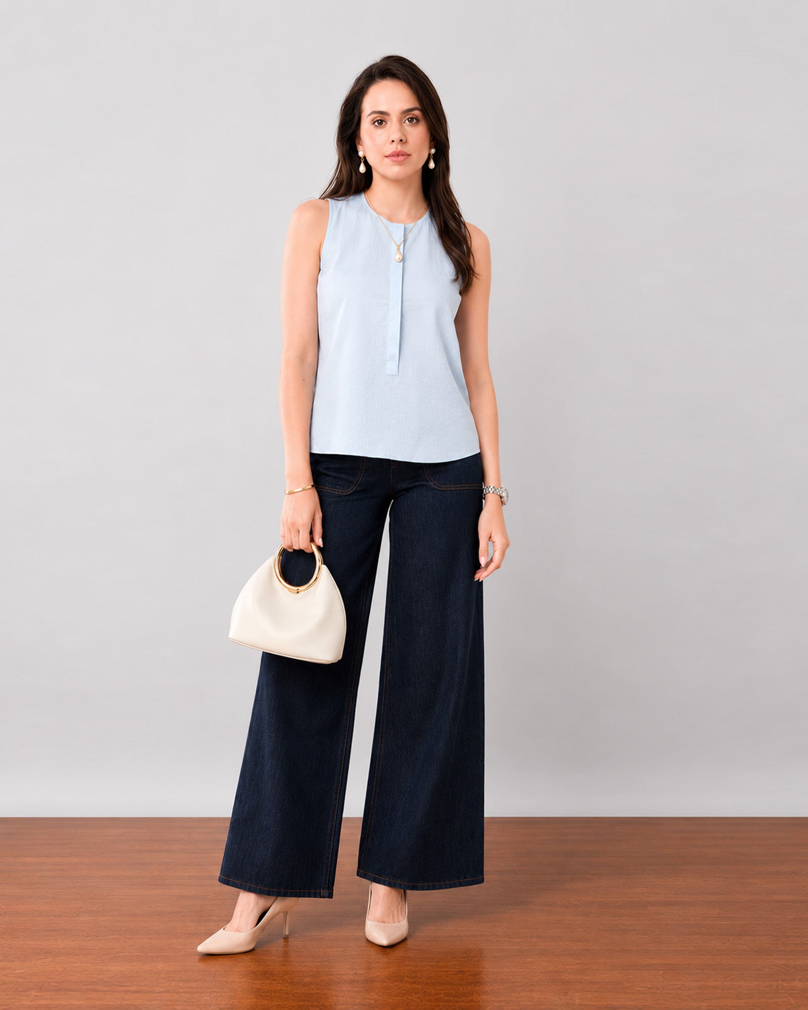 Gazillion Gusta minimalist sky blue sleeveless pin tucks top for women, full-length front view
