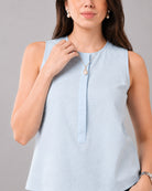 Close-up of Gusta sky blue top round neckline and front button placket