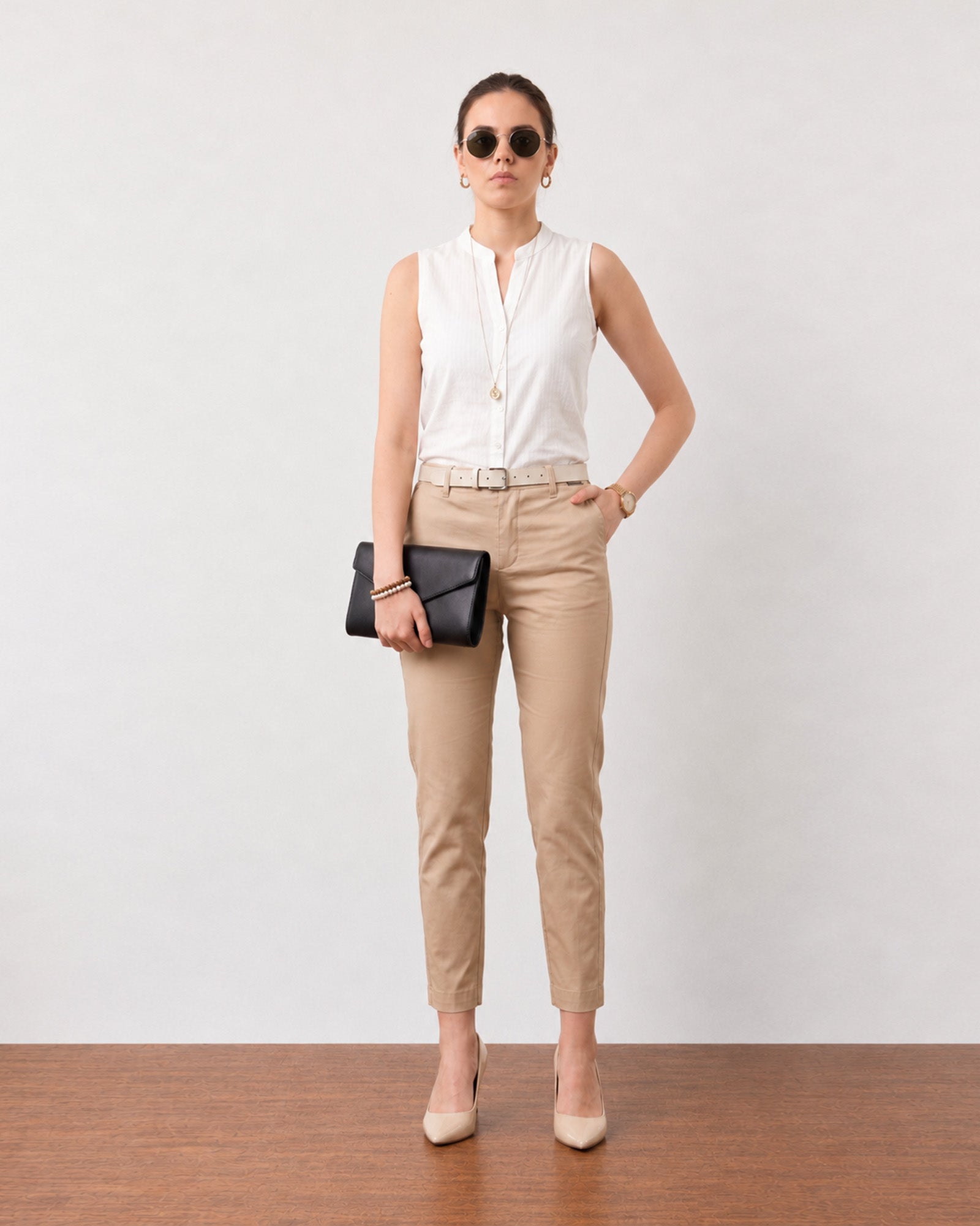 Gusta white sleeveless cotton top, angled three-quarter view