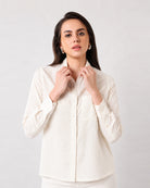 Close-up of Gwen beige linen shirt pointed collar, button placket and single chest pocket