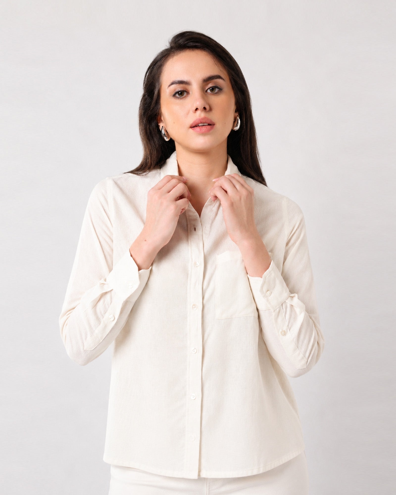 Close-up of Gwen beige linen shirt pointed collar, button placket and single chest pocket