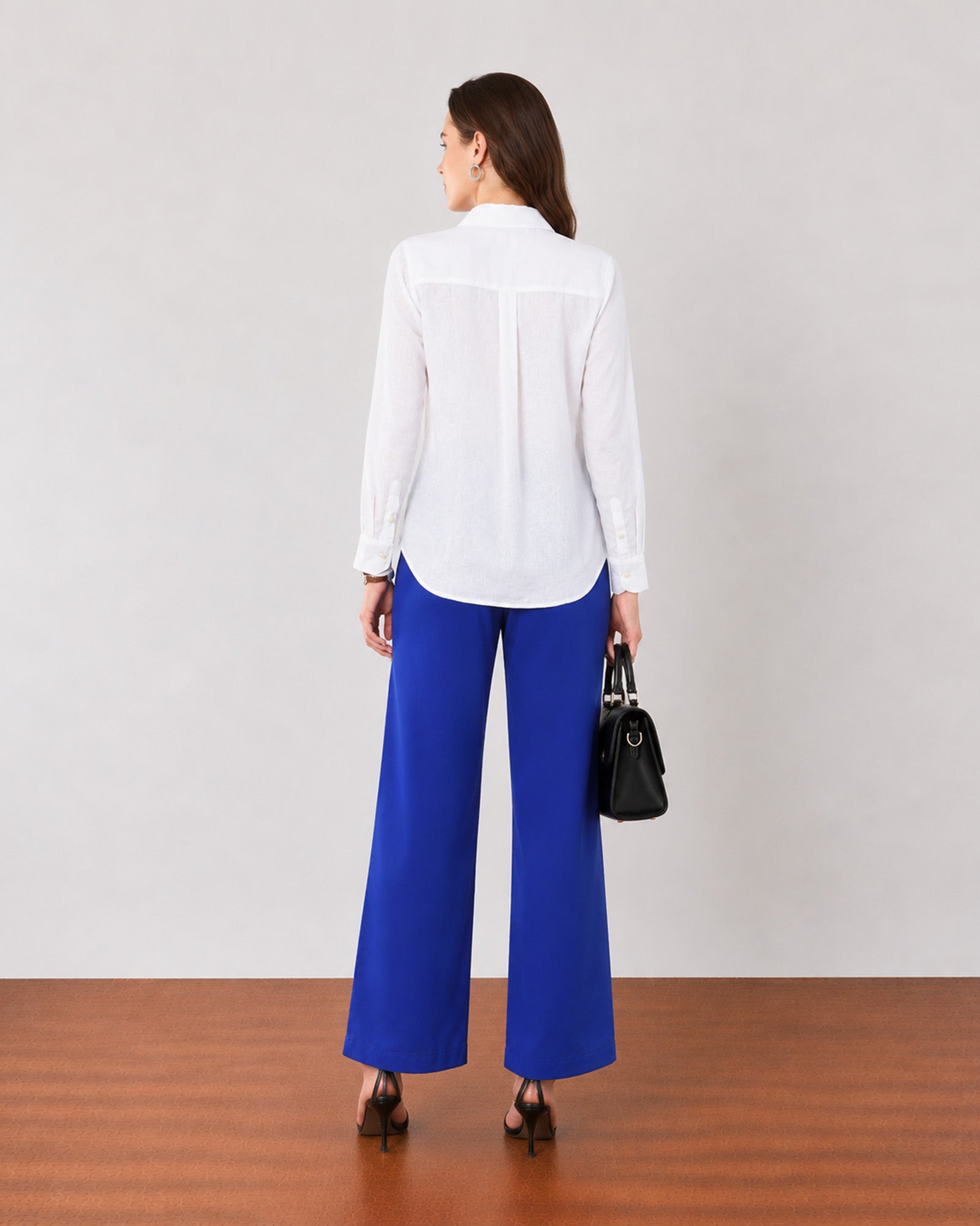 Gwen white soft linen shirt with a relaxed unlined fall, back view