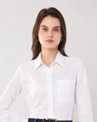 Close-up of Gwen white linen shirt pointed collar, button placket and single chest pocket
