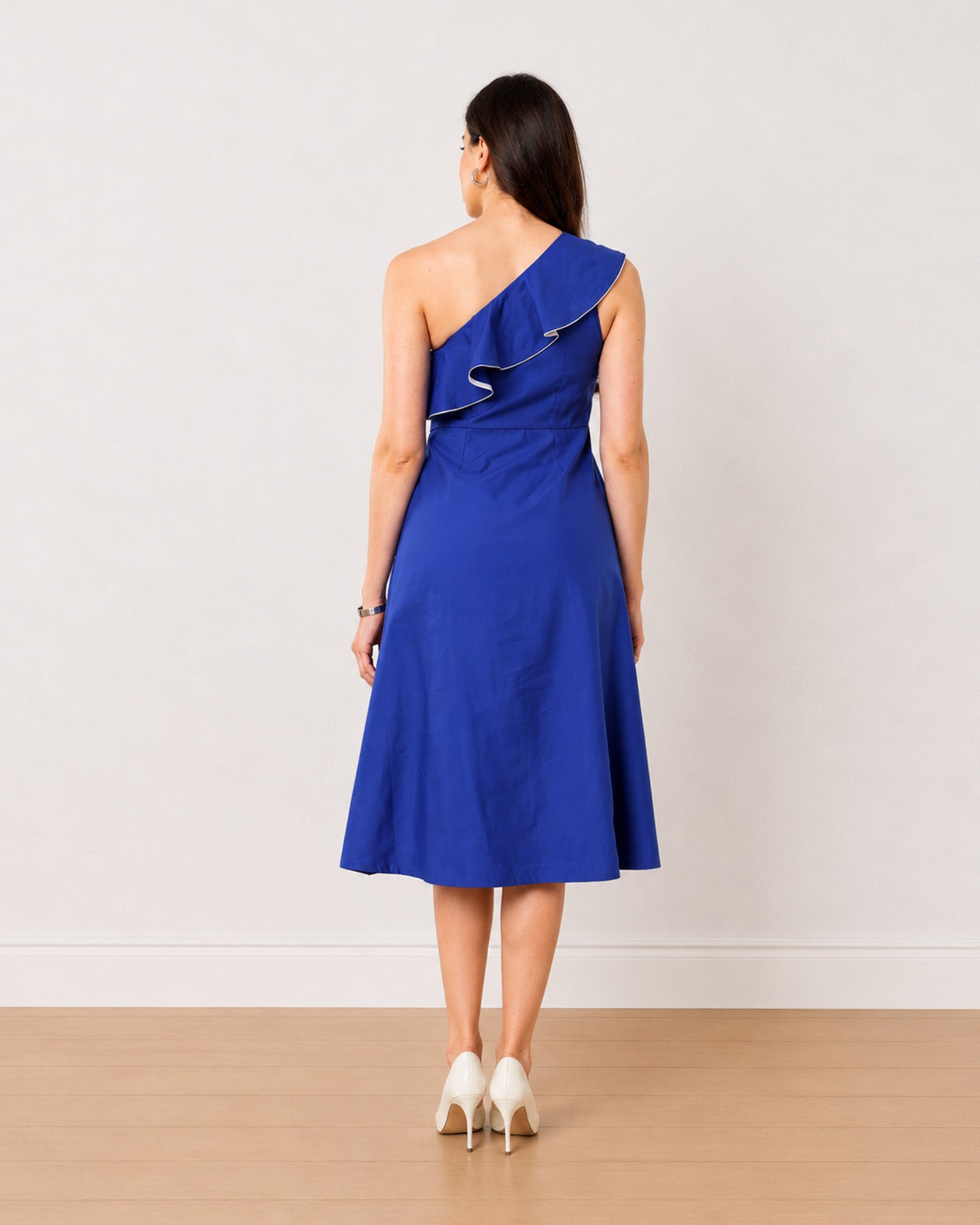 Gweneth royal blue one shoulder midi dress with a concealed side zip, back view
