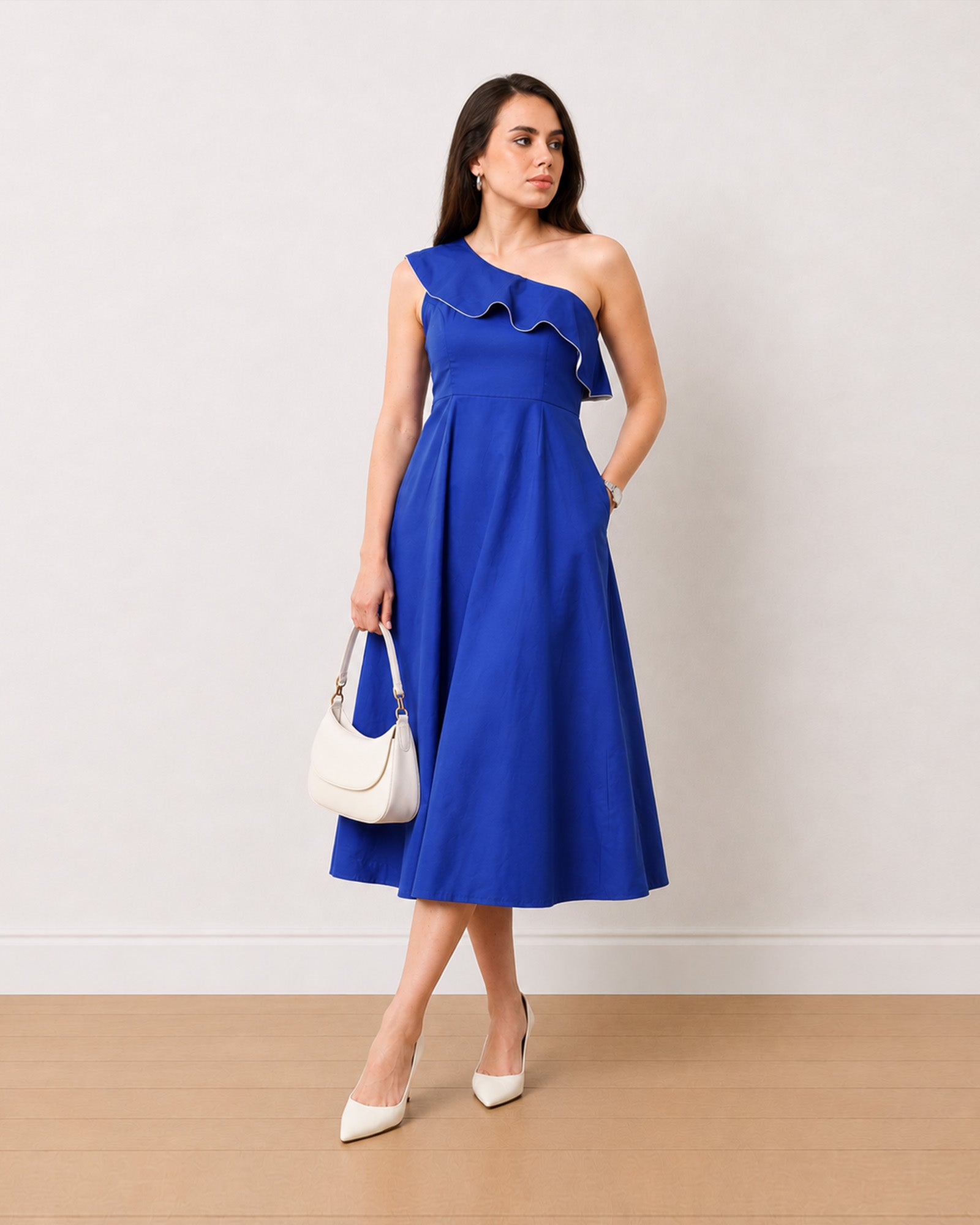 Gweneth royal blue fit and flare midi dress with a full skirt, walking view