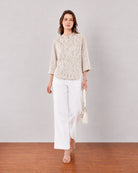 Heaven beige printed shirt styled with white trousers for summer office wear