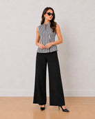 Hellen black and white striped cotton top with inward pleats at princess seams, front standing view