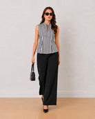Hellen black and white striped formal top styled with black wide-leg trousers