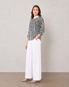 Helvia black and white striped shirt, angled view showing white contrast collar