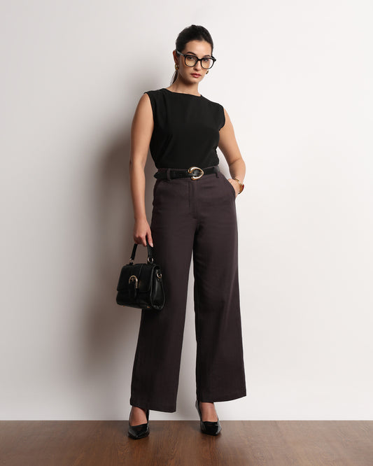 Henrietta dark grey herringbone straight pants styled with a shoulder bag, full-length front view