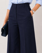Close-up of Henrietta navy blue straight pants showing cotton herringbone texture
