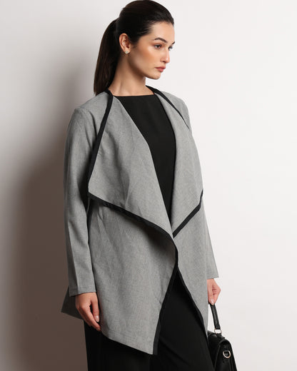Hermina dark grey drapy cape top, angled front view showing the cape drape