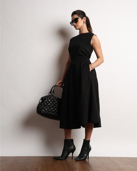 Hester black pleated full midi skirt, front view showing the flared silhouette