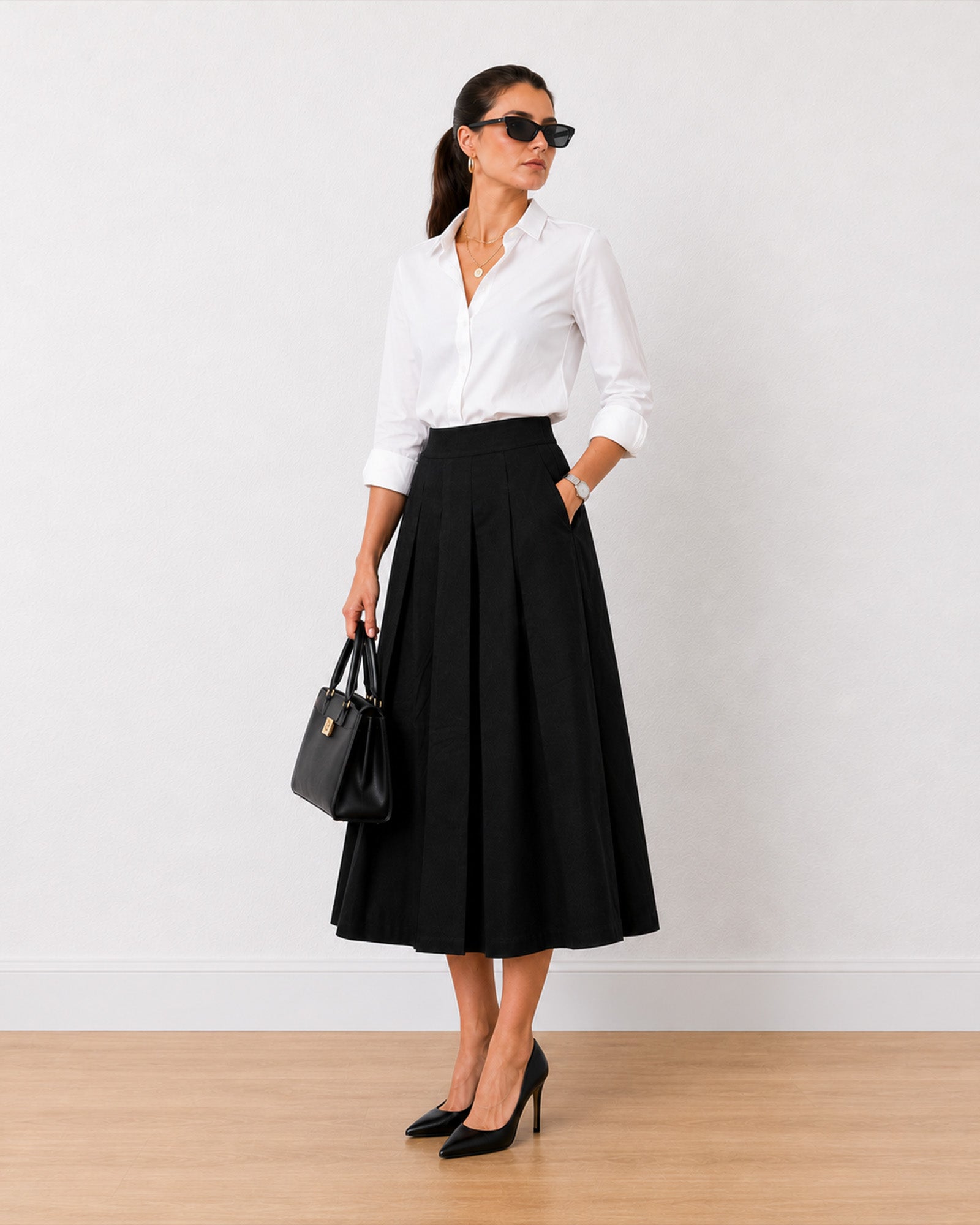 Hester black pleated cotton midi skirt styled with a white formal shirt