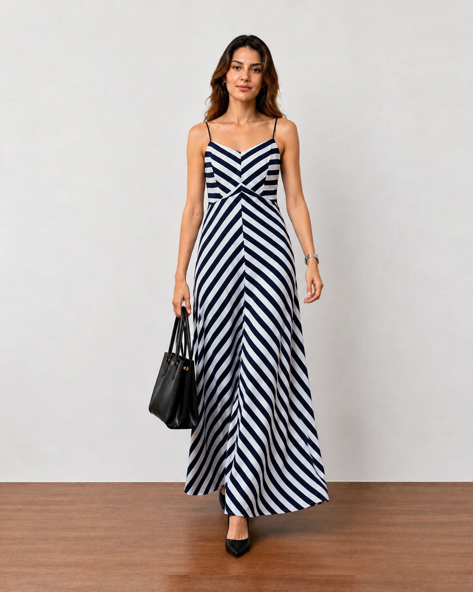 Hope black and white striped cotton maxi dress styled with a black handbag