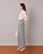 That baby pink formal shirt with tailored cuffs and side seam darts, side profile view