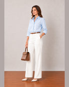 That sky blue stretch poplin shirt with rolled sleeves, angled three-quarter view