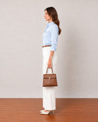 That sky blue formal shirt with tailored cuffs and side seam darts, side profile view