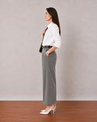 That white stretch poplin formal shirt with rolled sleeves and side seam darts, side profile view